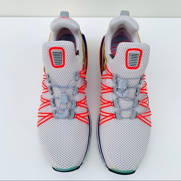 nike shox gravity vast grey metallic gold